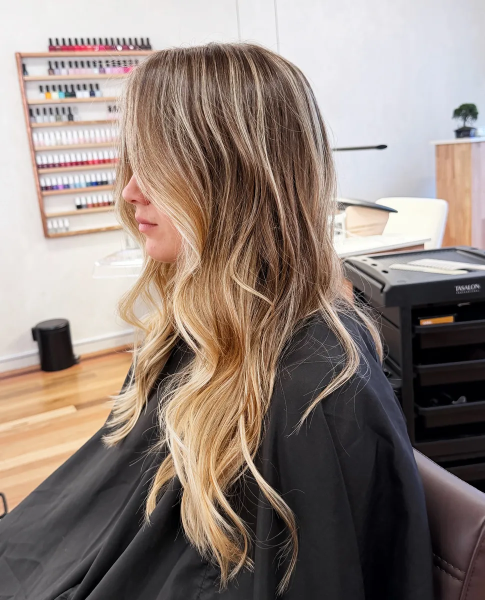 Client with warm blonde balayage colour