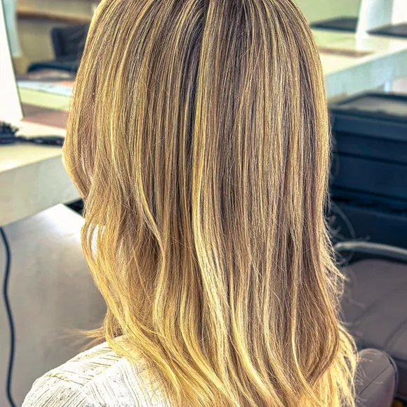 Back view of long hair with sun-kissed blonde balayage