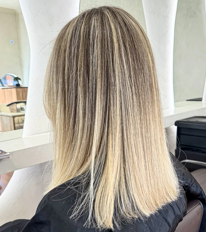 Client with sleek, glossy copper red hair