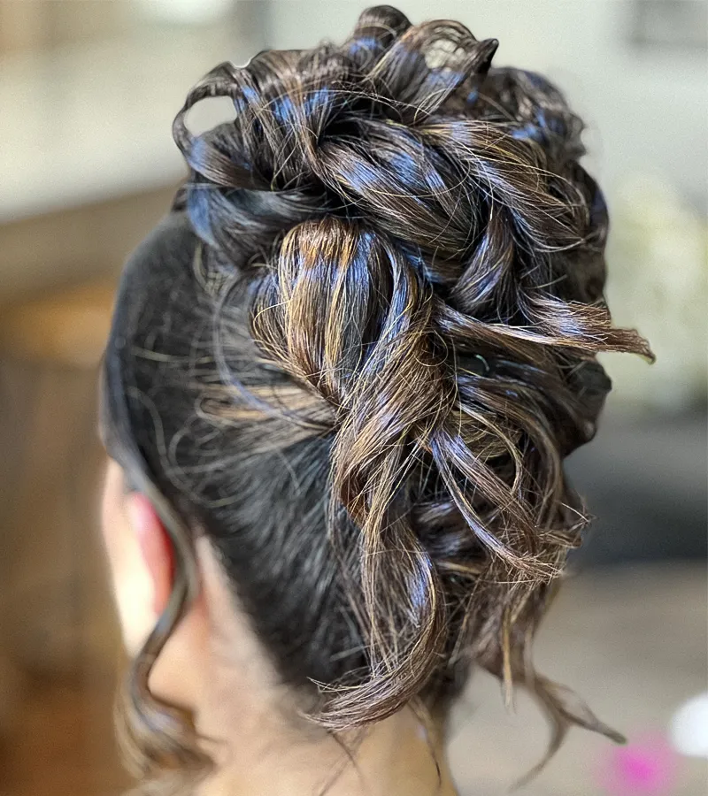 Client with smooth, shiny brunette balayage hair