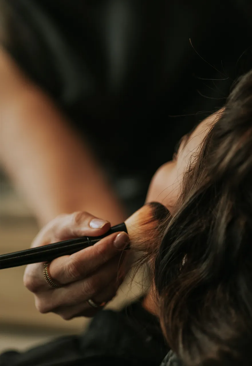 Makeup artist applying makeup at Olaya & Co. Byron Bay