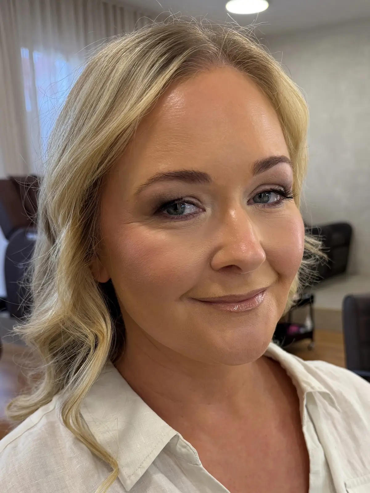 Warm brown smoky eye with soft bronzer and a rosy nude lip